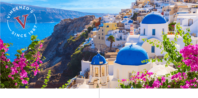 Santorini Greece - houses with bright cobalt blue beside water.